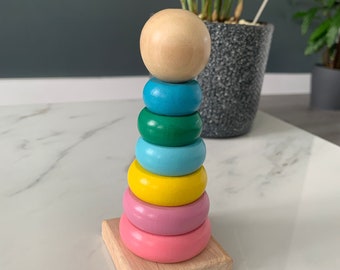 Wooden Montessori ring stacker in rainbow colours
