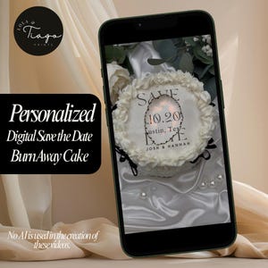 May include: A smartphone displays a white cake with the words "Save the Date" and the date 10.20. The cake is decorated with white frosting and surrounded by flowers. The phone is on a satin surface. Text on the phone reads "Austin, Tex" and "Josh & Hannah."
