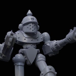 以下が含まれることがあります： スパイクの付いたヘルメット、シールド、大きなダブルバレルガンを装備したグレーの関節式ロボットのおもちゃです。