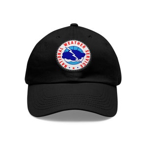 May include: A black baseball cap with a red, white, and blue embroidered patch that says "National Weather Service" with a lightning bolt and cloud graphic.