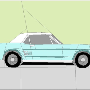 Puede incluir: Un coche vintage azul claro con techo blanco, ruedas negras y un interior gris. El coche está orientado hacia la derecha y está sobre una superficie gris.