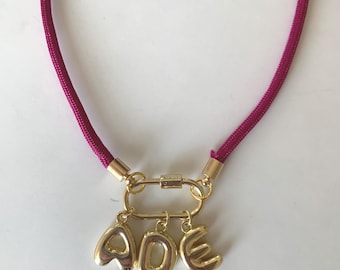 Personalized Magenta Pink Paracord Necklace with gold initials.