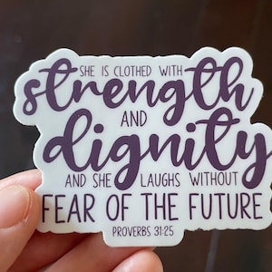 May include: A white sticker with purple text that reads "She is clothed with strength and dignity and she laughs without fear of the future." The text is from Proverbs 31:25.