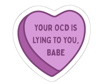 May include: A heart-shaped sticker with a purple background and white border. The sticker has the text "YOUR OCD IS LYING TO YOU, BABE" in white letters.
