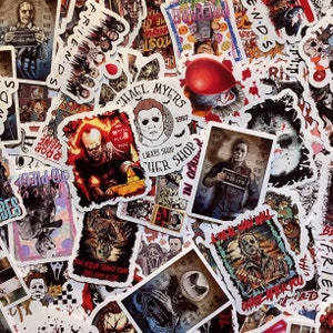 May include: A selection of colourful stickers featuring horror film characters and quotes. Stickers include images of Michael Myers, Pennywise, and Beetlejuice. Some stickers have text like "Friends" and "Prepare".