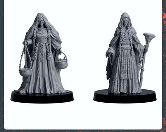 May include: Two gray 3D printed miniature figures of women wearing long robes and holding objects. The figure on the left is holding a scale and a cauldron. The figure on the right is holding a staff with a leaf at the top. The figures are standing on black bases.