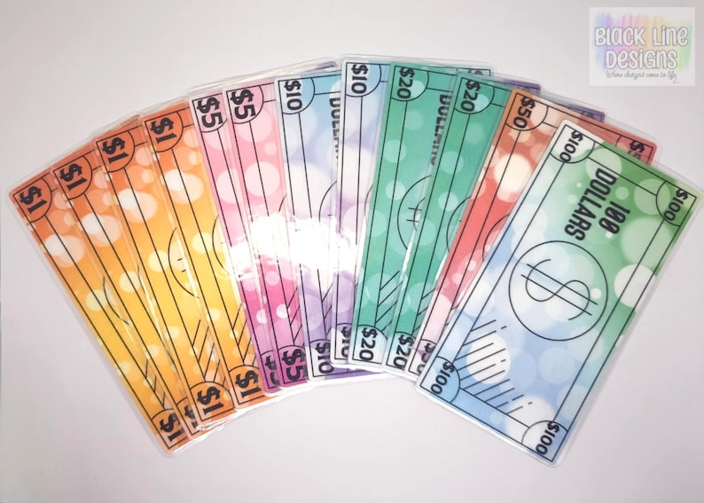 May include: A set of colorful play money bills with different denominations, including $1, $5, $10, $20, $50, and $100. The bills have a light, bubbly background and are printed with black text and lines.