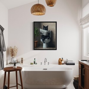 May include: A black cat sitting on a toilet reading a newspaper in a framed print. The print is hanging in a bathroom with a white bathtub, a wooden stool, and a brown rug.
