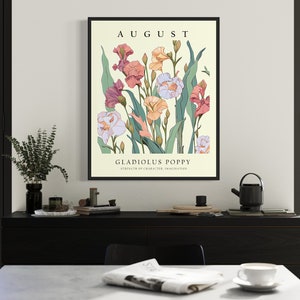 May include: A vintage botanical illustration print featuring a bouquet of pink, white, and orange gladiolus poppy flowers. The print is titled "August" and "Gladiolus Poppy" with the text "Strength of a warrior, true inspiration".