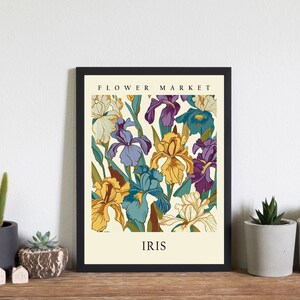 May include: A vintage-style poster with a floral design featuring a variety of irises in shades of purple, yellow, and blue. The poster has the text "FLOWER MARKET" and "IRIS" printed on it.