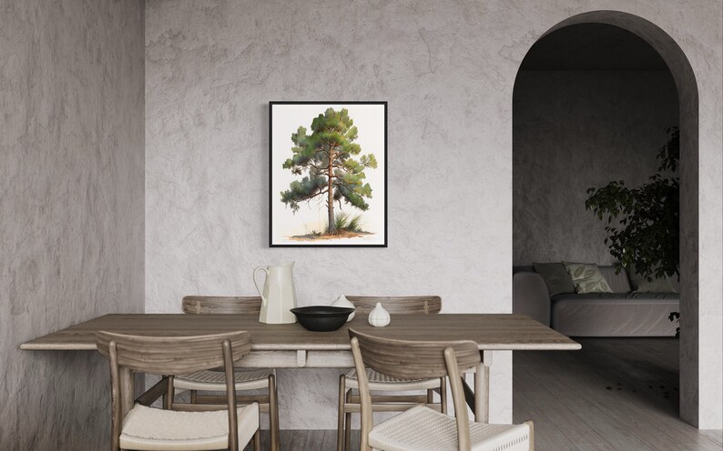 May include: A framed watercolor painting of a green pine tree on a white background. The painting is hanging on a light gray wall in a dining room with a wooden table and chairs.