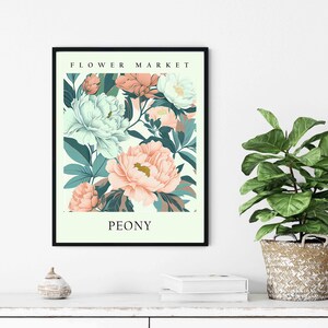 Może przedstawiać: Wydruk w ramie z kwiatowym wzorem przedstawiającym r&oacute;żowe i białe piwonie na jasnozielonym tle. Na wydruku widnieje tekst "FLOWER MARKET" i "PEONY".