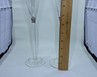 2 MCM champagne flutes with metal accent