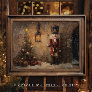 May include: A framed painting of a Christmas scene featuring a nutcracker soldier, a decorated Christmas tree, and a lantern. The painting has a warm color palette with a vintage aesthetic. The text "© COLOUR WHISPERS // ON ETSY" is visible at the bottom.
