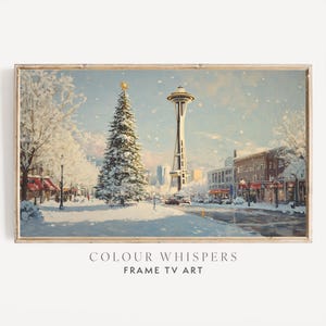 May include: A snowy winter scene with the Space Needle in Seattle, Washington. A Christmas tree stands in the foreground with snow-covered buildings and trees in the background.