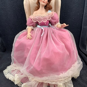 Vintage 1999 Patricia Rose Doll With Mauve Dress Seated In Chair - K534