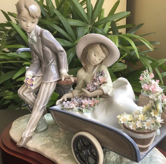 Lladro Country Ride Figurine Depicting a Boy Riding a Bike With a