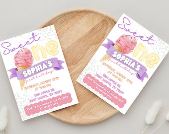 May include: Two invitations with a watercolor ice cream cone design. The invitations read "Sweet One" and "Sophia's first birthday!" with event details. The background is white with colorful sprinkles, and the invitations are on a wooden tray.