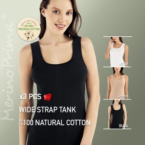 Peut inclure: Un ensemble de trois d&eacute;bardeurs &agrave; bretelles larges en coton 100% naturel. Les d&eacute;bardeurs sont disponibles en noir, blanc et cr&egrave;me.