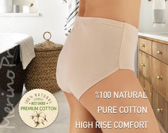 May include: A pair of high-rise underwear made from 100% natural pure cotton. The underwear is a light beige color and has a high waist. The text on the image reads: "100% NATURAL, BEST CHOICE, PREMIUM COTTON, %100 NATURAL, PURE COTTON, HIGH RISE COMFORT."
