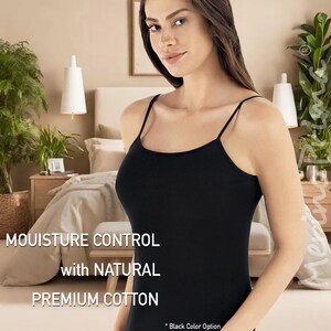 May include: A black tank top made of premium cotton with moisture control. The tank top has thin straps and a scoop neck. The text "Moisture Control with Natural Premium Cotton" is displayed on the image.