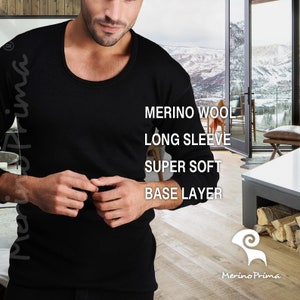 May include: A black long-sleeved base layer top made from merino wool. The top is super soft and features the text "Merino Wool", "Long Sleeve", "Super Soft", and "Base Layer".