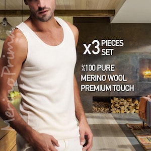 May include: Cream-colored merino wool tank top set. The image shows a three-piece set of tank tops. The text on the image reads "x3 pieces set", "%100 pure merino wool premium touch". The tank top has a scoop neck.