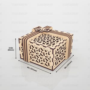 May include: A square wooden gift box with a laser-cut floral pattern on the lid and sides, featuring a decorative bow on top. The box measures 4 inches by 4 inches by 2.5 inches, with light wood panels and dark brown accents on the edges and bow.