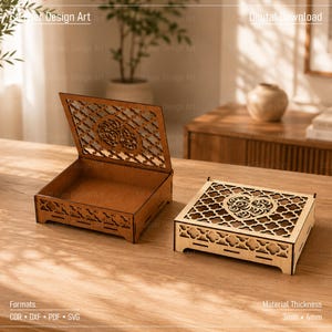 May include: Two square wooden boxes with laser-cut lattice patterns and a central heart design. One box is open, revealing a hollow interior, while the other is closed. The text "Laser Design Art" and "Digital Download" is visible, along with "Formats: CDR, DXF, PDF, SVG" and "Material Thickness: 3mm, 4mm".