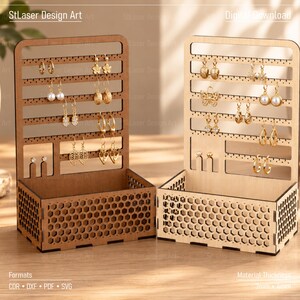 May include: Two wooden jewelry organizers with a honeycomb pattern on the base and multiple horizontal slots for hanging earrings. The organizers feature text at the top reading StLaser Design Art and Digital Download, with file formats listed below.