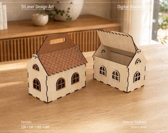 May include: Two house-shaped wooden boxes with light wood walls and dark brown roofs. One box is closed with a handle, while the other is open with a hinged roof. Both feature arched windows and laser-cut details. Text includes StLaser Design Art, Digital Download, Formats CDR, DXF, PDF, SVG, and Material Thickness 3mm - 4mm.