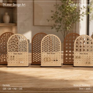 May include: Three arched wooden earring displays with laser-cut patterns, including geometric, honeycomb, and cane designs. Each stand features a flat base, a perforated panel for jewellery, and the text Your Name printed on the front surface.