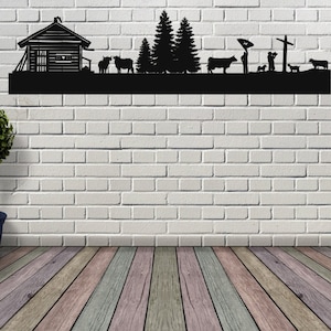 Puede incluir: Arte de pared de metal negro que representa una cabaña, árboles, vacas y personas. El arte está montado en una pared de ladrillo blanco.