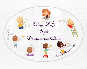 May include: An oval white plaque featuring colorful illustrations of children drawing. The text reads: Classe MS, Agnès, Maîtresse trop Classe, by Be my BB Box, and de la part de Melyne 2021-2022. The children are depicted in various poses.