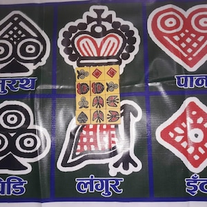 May include: A colorful game board featuring six distinct card suit symbols in black, white, and red, each with unique designs. The board also includes text in a foreign language.