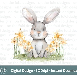 May include: A watercolor illustration of a gray bunny sitting in a field of yellow daffodils. The bunny has large ears and a sweet expression. The background is white.