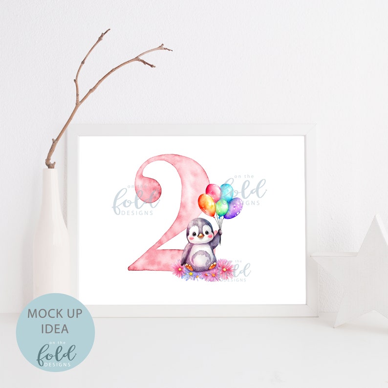 May include: A pink number two with a penguin holding colorful balloons. The text "Go the Fold Designs" is in the top right corner of the image.
