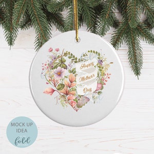 May include: White ceramic ornament with a floral heart design and the text "Happy Mother's Day" in gold lettering.
