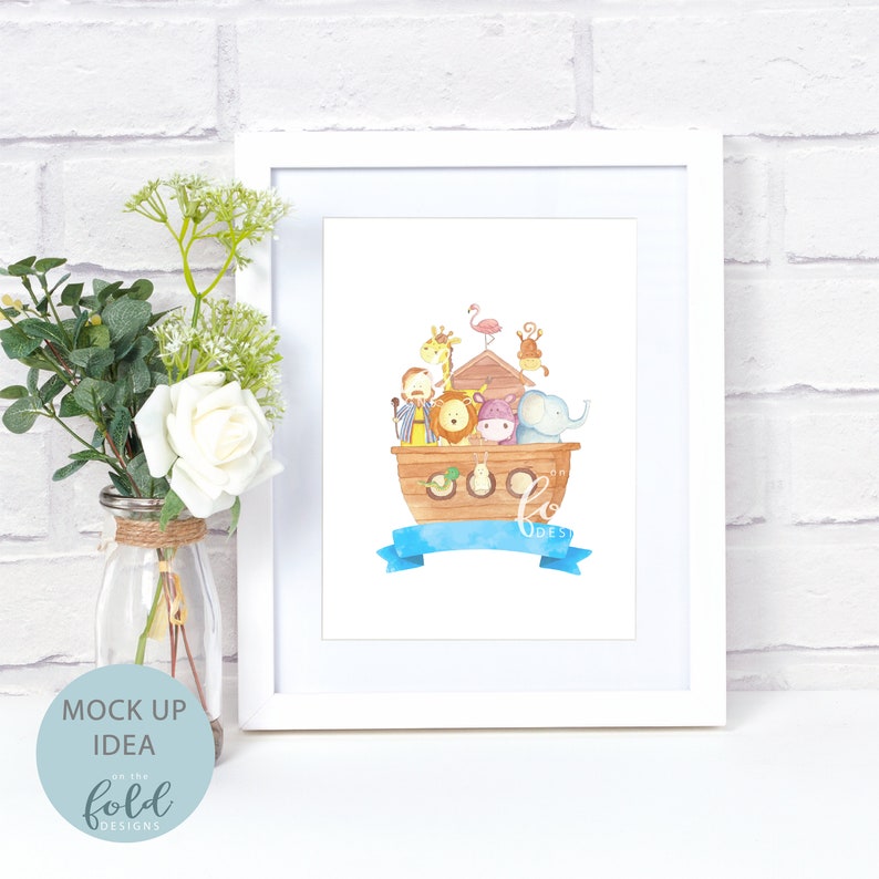 May include: A framed watercolor print featuring Noah's Ark with various animals. The ark is brown, and the animals include a giraffe, lion, elephant, and monkey. A blue banner with the name "BODES" is at the bottom. The frame is white.