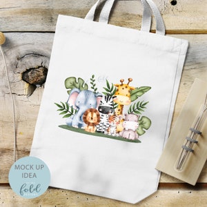 May include: A white tote bag with a design of a group of jungle animals. The animals include an elephant, a zebra, a giraffe, a lion, a tiger, and a hippopotamus. The animals are surrounded by green leaves.