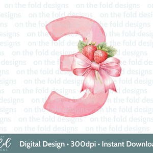 May include: Pink watercolor number three with a pink bow and two red strawberries with green leaves.  The number is decorated with a watercolor wash.