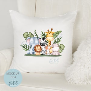 May include: White throw pillow with a watercolor illustration of a group of jungle animals including a giraffe, zebra, elephant, lion, tiger, and hippopotamus. The animals are surrounded by green leaves. The text "on the fold designs" is printed in blue at the bottom of the pillow.