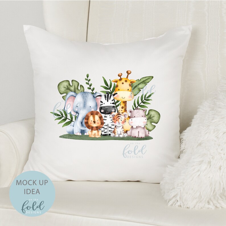 May include: White throw pillow with a watercolor illustration of a group of jungle animals including a giraffe, zebra, elephant, lion, tiger, and hippopotamus. The animals are surrounded by green leaves. The text "on the fold designs" is printed in blue at the bottom of the pillow.