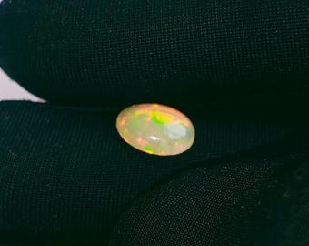 Ethiopian Opal Cabochon: Oval Gemstone for Ring Making (1.05 Ct, 9.1x6.5x3.2mm)