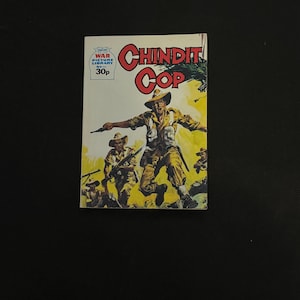 May include: A vintage comic book titled "Chindit Cop" with a cover illustration of soldiers in action. The cover features the text "War Picture Library" and the price "30p". The comic book has a colorful design with a yellow and red color scheme.