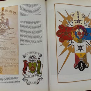 May include: A page from a book featuring illustrations and text. One illustration is a colorful cross with star and geometric designs. The other is a document with text and an emblem. The text includes the words "MASONIC CHARTER" and "THE EQUINOX".