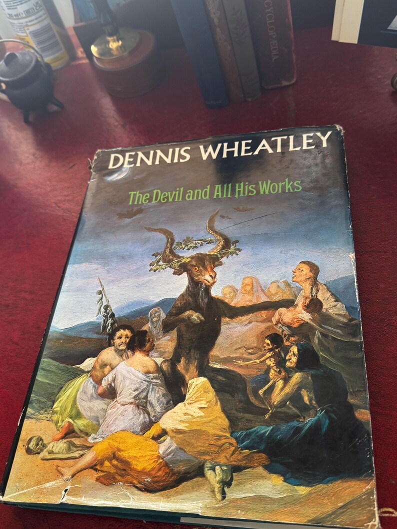 May include: A white ceramic mug with a black handle and the text "But First, Coffee" in a black, bold font. The mug is sitting on a wooden surface. The mug is 4 inches tall.