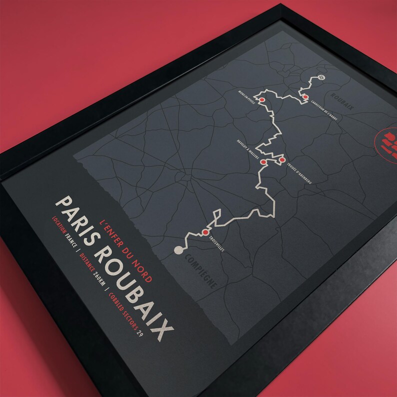 May include: A black and white map of the Paris-Roubaix cycling race route. The map shows the route from Compi&egrave;gne to Roubaix, with the text "L'Enfer du Nord" and "Paris Roubaix" in white. The map also includes the distance of the race, 260 km, and the number of cobbled sectors, 29.