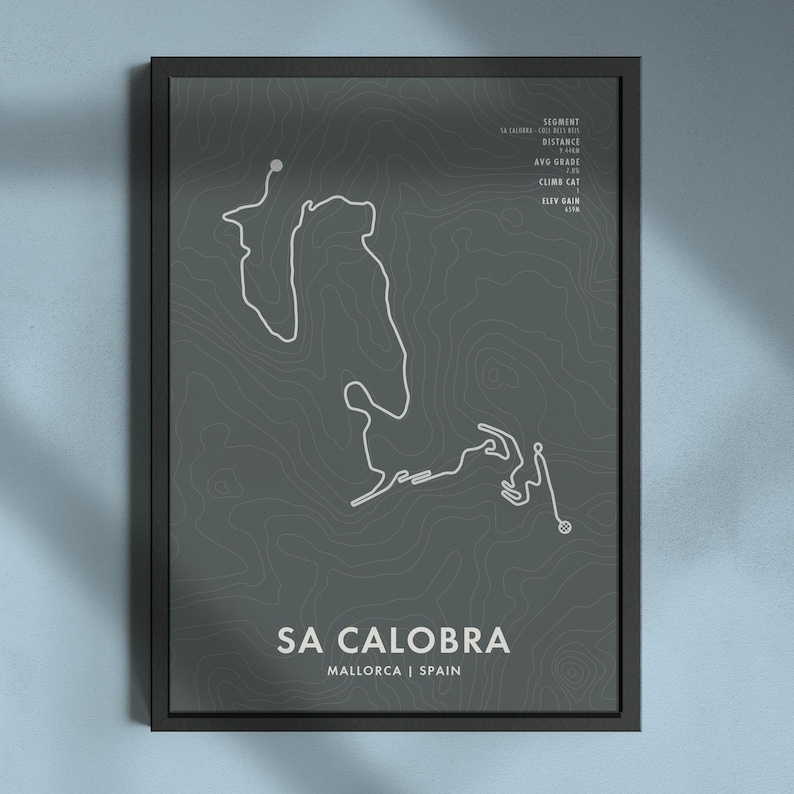 May include: A black and white topographic map print of the Sa Calobra cycling route in Mallorca, Spain. The print features the name of the route, "Sa Calobra", and the location, "Mallorca | Spain".