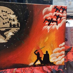 May include: A hand-painted canvas depicting a scene from Star Wars. The left side shows the Death Star with X-wings flying around it. The right side shows Darth Vader and Luke Skywalker fighting with lightsabers in a fiery orange and yellow sky.